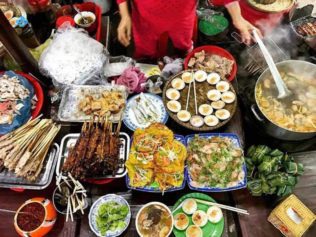 Ho Chi Minh City street food tour seen from the sidewalk The rhythm of a Ho Chi Minh City street food tour after sunset and into the evening flow
